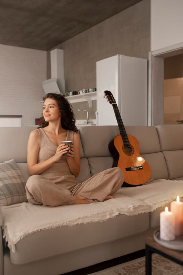 woman-digital-disconnecting-home-with-guitar